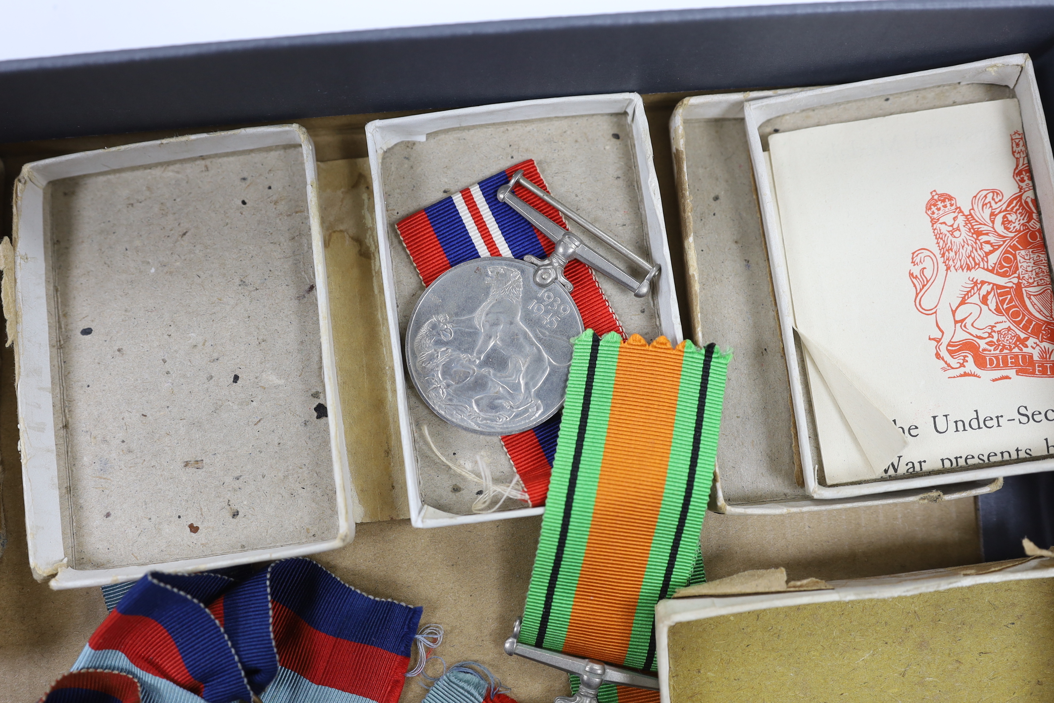 Fifteen WWII medals including some with original card boxes, including; eight War medals, three Defence medals and four 1939-1945 Stars